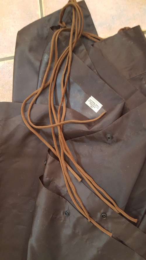 used SADF era dark nutria brown poncho almost unused no damage all strings present - water proofing