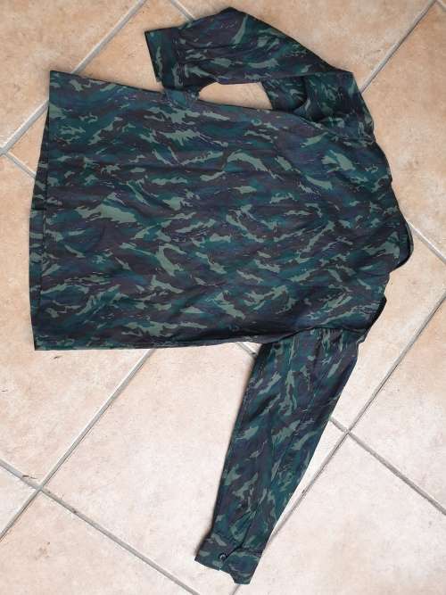 original Border war era SWAPO/PLAN used Libyan Blue camo patt l//s shirt with original Arabic label