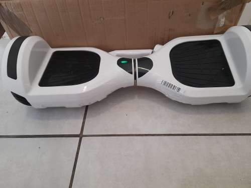 *****6.5 Inch Smart Hoverboard With Bluetooth Speaker in box with charger**fault on one wheel**