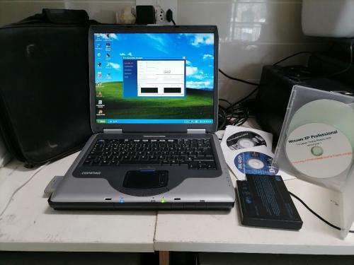 **COMPAQ PRESARIO 2500 WITH WIFI CARD,DISKS,POWER SUPPLY,BAG*OLD BUT WORKING AND BATTERY GOOD+SPARE*