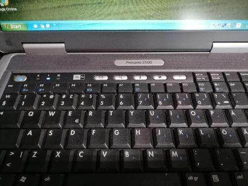 **COMPAQ PRESARIO 2500 WITH WIFI CARD,DISKS,POWER SUPPLY,BAG*OLD BUT WORKING AND BATTERY GOOD+SPARE*