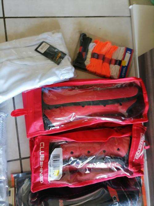 **HUGE SPORT SHOP LIQUIDATION*LOT OF BRAND NEW SHIN GUARDS,GLOVES,CRICKET PANTS ETC ETC**