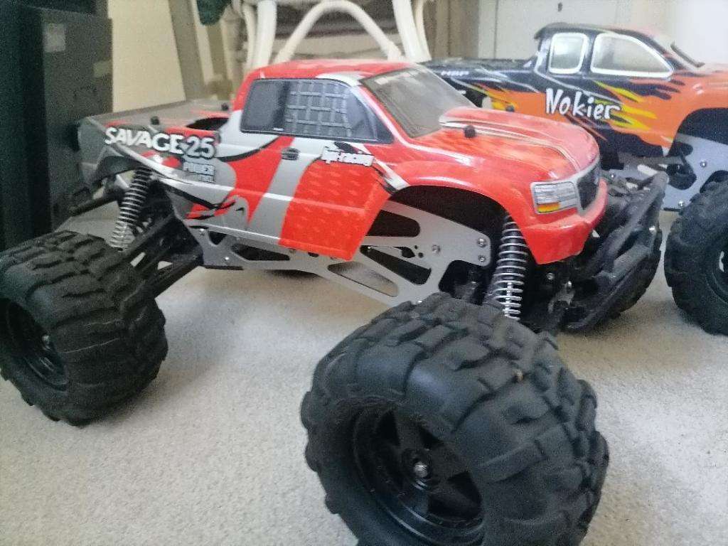 *AWESOME PROJECT*2 X HPI BIG SAVAGE NITRO TRUCKS WITH 2 MOTORS,MANY SPARES,NEW NUTS BOLTS,BEARINGS**