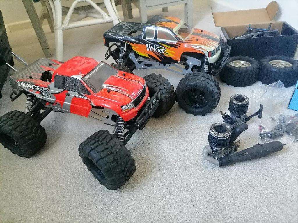 *AWESOME PROJECT*2 X HPI BIG SAVAGE NITRO TRUCKS WITH 2 MOTORS,MANY SPARES,NEW NUTS BOLTS,BEARINGS**