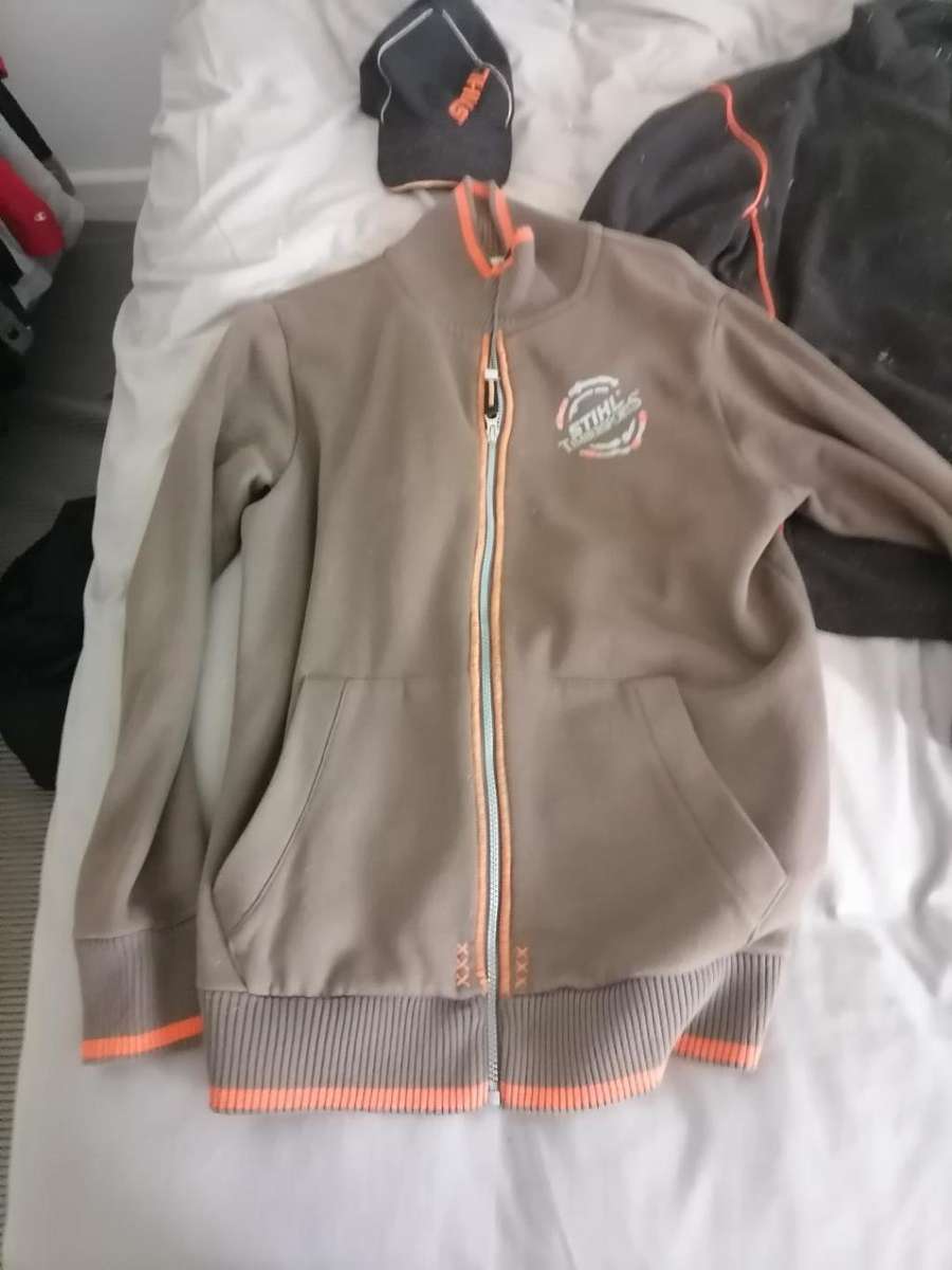 **STORAGE CLEARANCE*LOT OF STIHL JERSEYS,CAP,SCARF*SIZE LARGE**ONE BID FOR THE LOT**