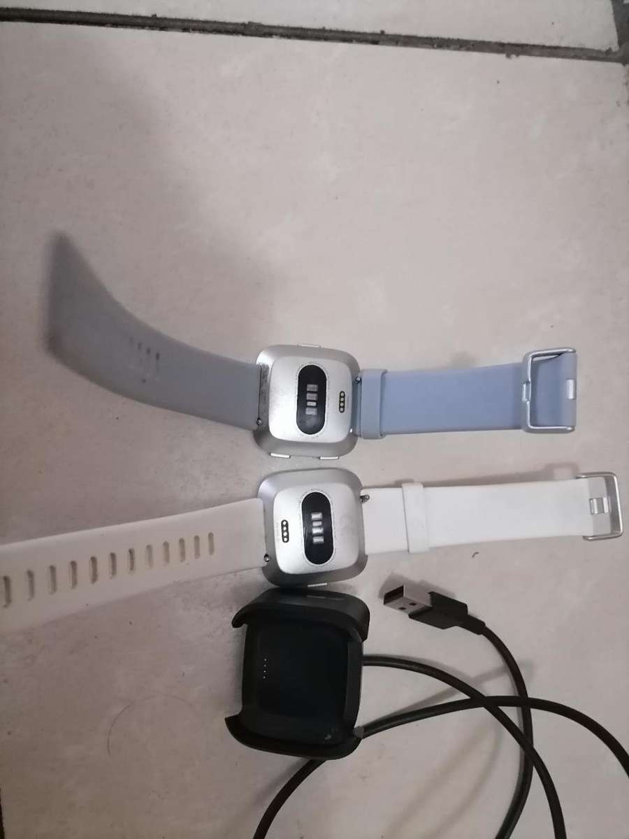 2 X FITBIT SMART WATCHES, ONE POWERS ON,OTHER BLANK, ONE BID FOR BOTH