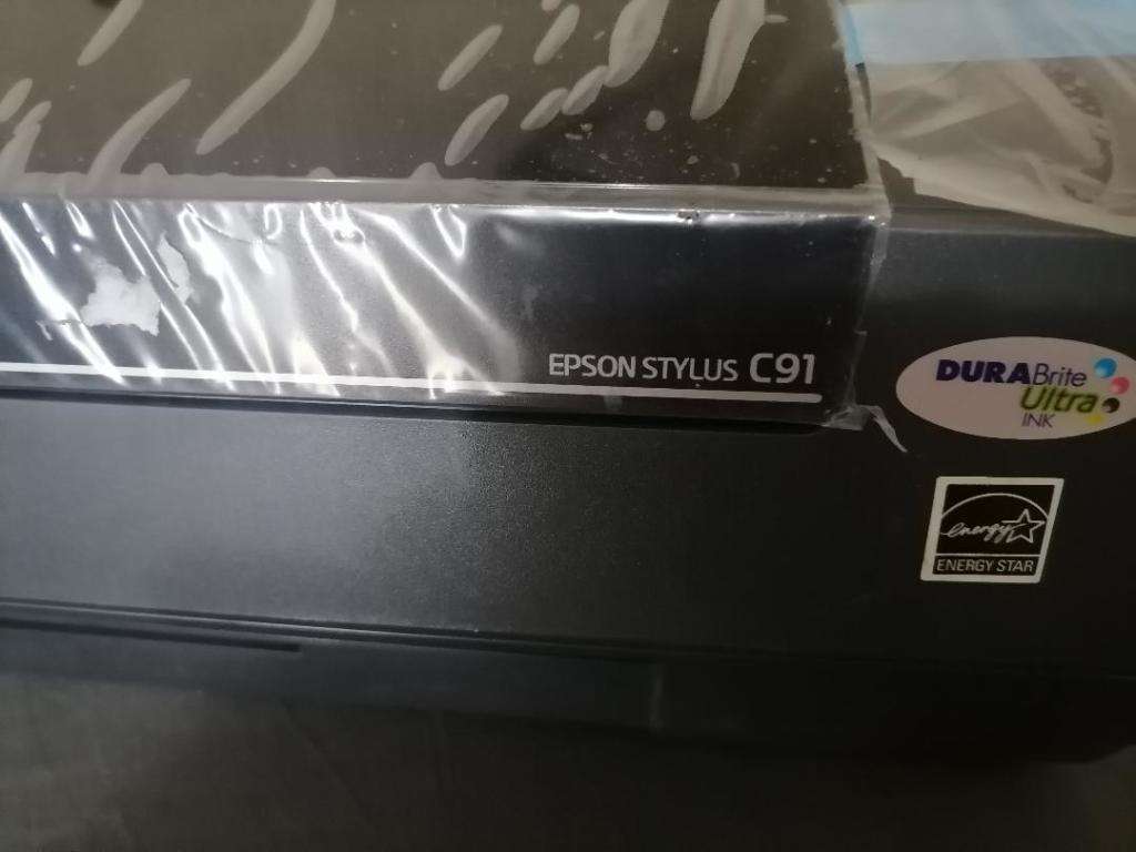 EPSON SYTLUS C91 COLOUR PRINTER, ITEM LOOKS NEW WITH PLASTIC ON, NOT TESTED