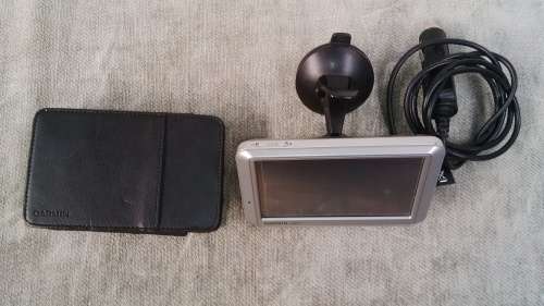Garmin Nuvi 710 GPS With Window Screen Docking Mount and Charger In Perfect Working Condition