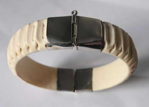 CARVED BONE AND SILVER BANGLE
