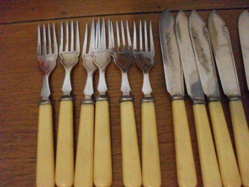 SOME VINTAGE BONE HANDLE EPNS FISH KNIVES AND FORKS