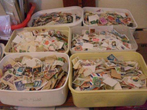 6 X 2 LITER ICE CREAM CONTAINERS FILLED WITH WORLD STAMPS....