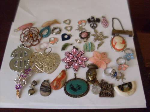 A COLLECTION OF VARIOUS PENDANTS ETC ETC ETC