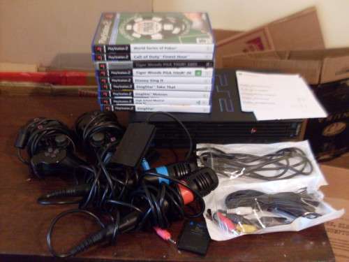 PS2 CONSOLE + SINGSTAR MIKES/REMOTES /CABLES AND 9 SINGSTAR /GAMES