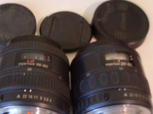 2 LENSES FOR PENTAX.....AND 3 LENS COVERS....