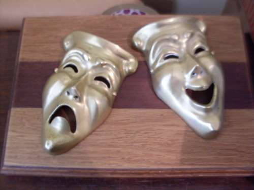 2 STUNNING BRASS MASKS MOUNTED ON A BEAUTIFUL SOLID PIECE OF WOOD....3KG