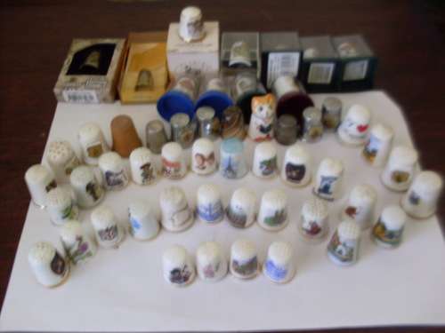 HERE IS A COLLECTION OF 53 VARIOUS BEAUTIFUL THIMBLES HERE