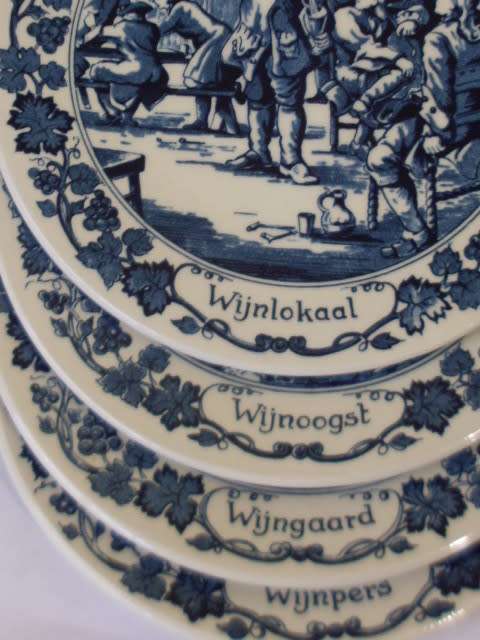 A COLLECTION OF 8 DUTCH DELFT BLUE AND WHITE WALL PLATES....16 CM X 16 CM EACH