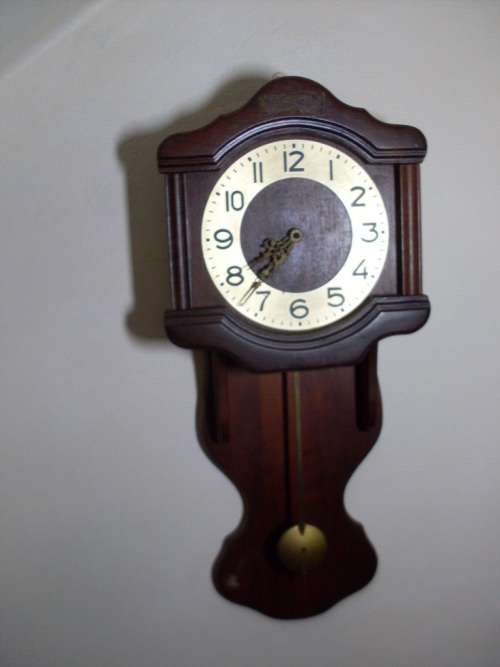 PRETTY WALL CLOCK QUARTZ (GERMANY)...58 CM LENGTH