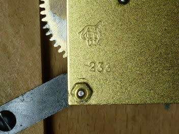 VERY UNUSUAL SHAPE WALL CLOCK CIRCA 1930`S....MAKER U. M. MULLER WITH LION LOGO