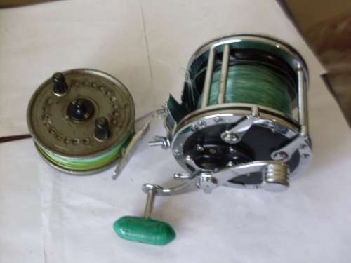 2 FISHING REELS ...1 PENN NO 49 REEL AND A FLY FISHING REEL
