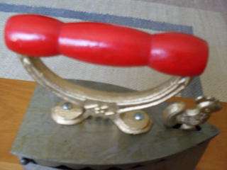 AN ANTIQUE DOORSTOP (NEW COALSTOVE IRON)