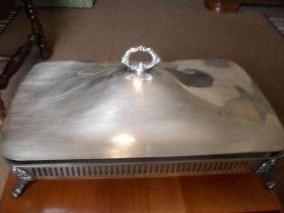 A FOOTED SOUFFLE DISH WITH RING HANDLE LID AND GLASS DISH