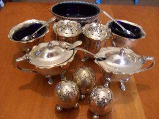 A COLLECTION OF EPNS CONDIMENT POTS WITH BLUE GLASS INNERS