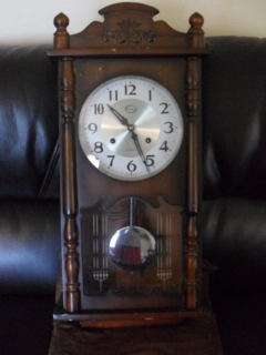 A VERY NICE DARK WOOD WALL CLOCK COMPLETE AND WORKING !!!!!!!!
