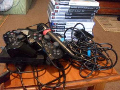 IMMACULATE CONDITION SONY PS2 + 2 REMOTES +11 GAMES+MIKES+ MORE *****