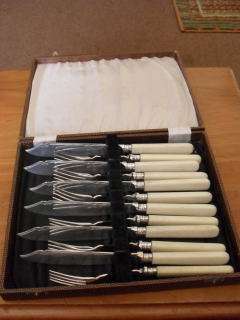 A BOXED EPNS BONEHANDLED 6 FISH KNIFE & 6 FORK SET