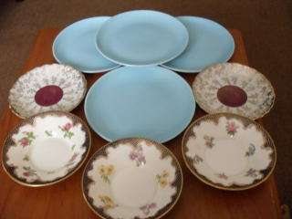 5 ANTIQUE SAUCERS AND 4 POOLE SIDE PLATES .....