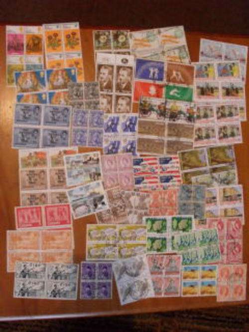 13 MINT BLOCKS OF 4 AND 29 USED BLOCKS OF 4 FROM AROUND THE WORLD