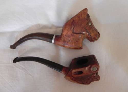 TWO COLLECTIBLE CARVED SMOKING PIPES