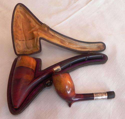 TWO SILVER HALLMARKED SMOKING PIPES. 1917 AND 1900. ONE IN ORIGINAL LEATHER CASE!