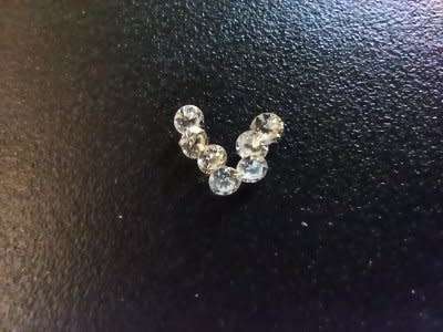 7 LARGE 0.04CT G-H VVS ROUND CUT DIAMONDS. 7 DIAMONDS UNDER 1 BID.