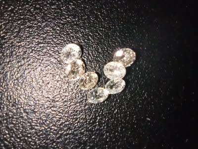 7 LARGE 0.04CT G-H VVS ROUND CUT DIAMONDS. 7 DIAMONDS UNDER 1 BID.