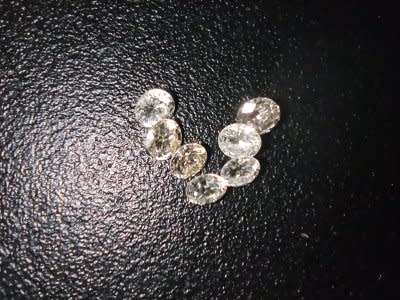 7 LARGE 0.04CT G-H VVS ROUND CUT DIAMONDS. 7 DIAMONDS UNDER 1 BID.