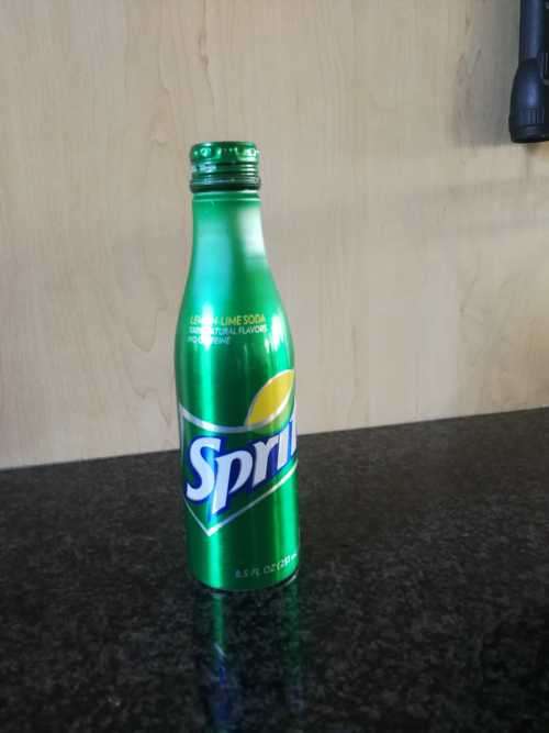 RARE- Metal Sprite 8.5 FL OZ bottle