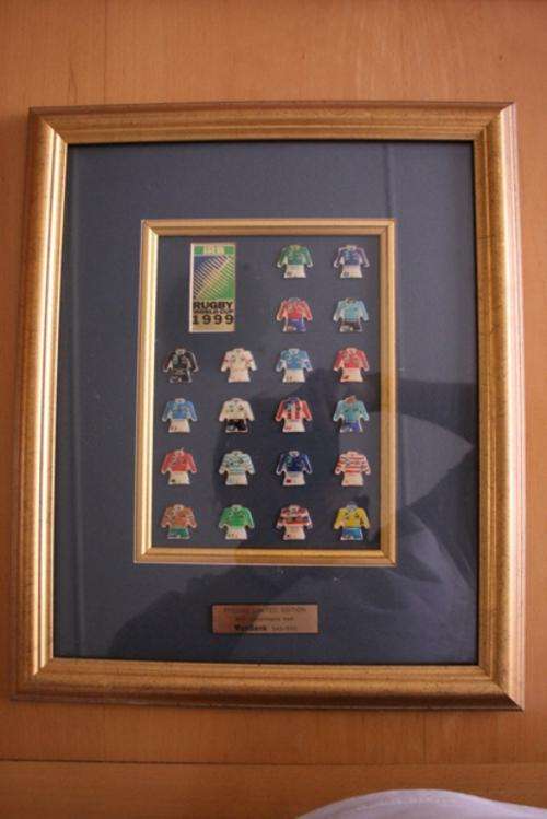 1999 Rugby World Cup framed plaque of team jerseys.