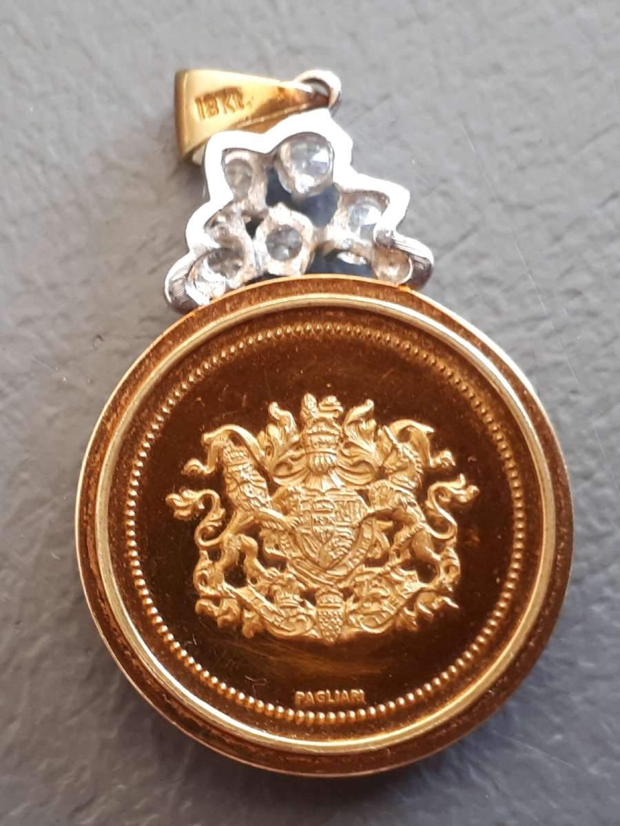 1981 ROYAL WEDDING GOLD 22CT  MEDALLION SET IN 18 CT GOLD  HOLDER : TOTAL MASS 20,59GM