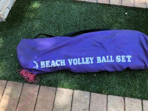 Beach volleyball net and polls
