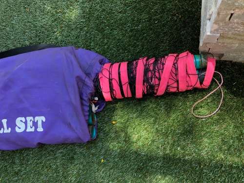 Beach volleyball net and polls