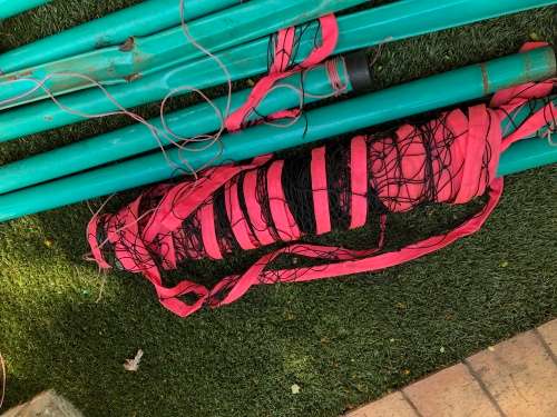 Beach volleyball net and polls