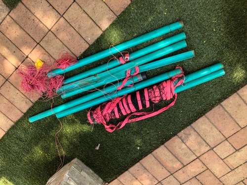 Beach volleyball net and polls