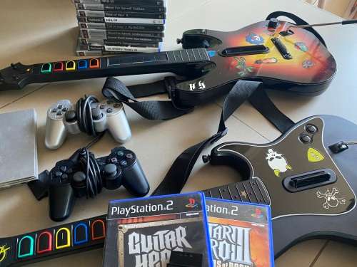 Large PS2 bundle with 13 games, 3 guitars, 2 controllers and more - very nice