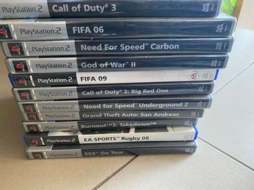 Large PS2 bundle with 13 games, 3 guitars, 2 controllers and more - very nice
