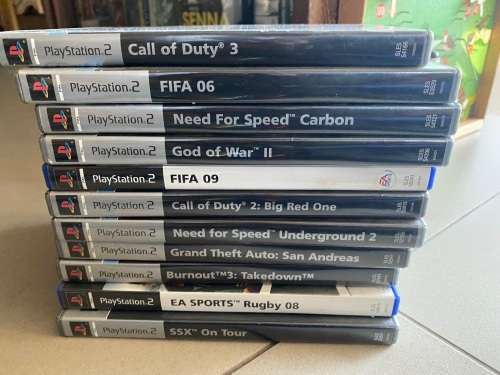 Large PS2 bundle with 13 games, 3 guitars, 2 controllers and more - very nice