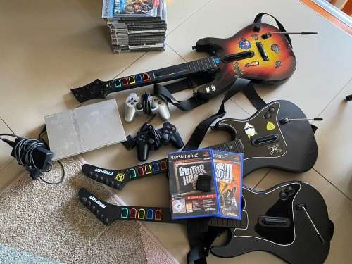 Large PS2 bundle with 13 games, 3 guitars, 2 controllers and more - very nice
