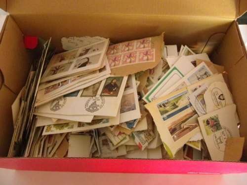 Large Shoebox packed with stamps on paper (mainly FDC cuttings)