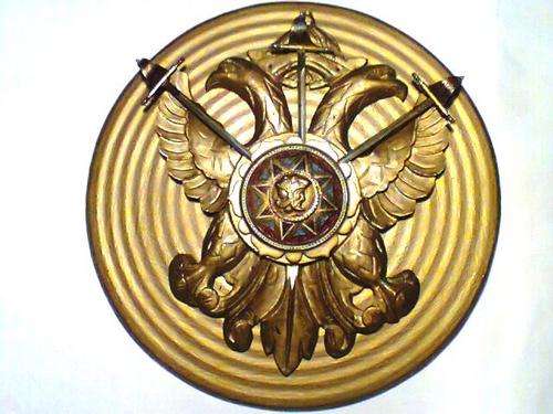 A ROMAN Sheild with 3 swords.